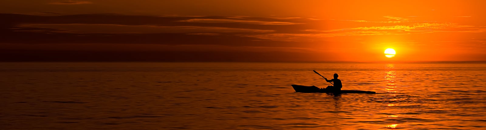 Kayak in the ocean during sunset in Freeport, Bahamas