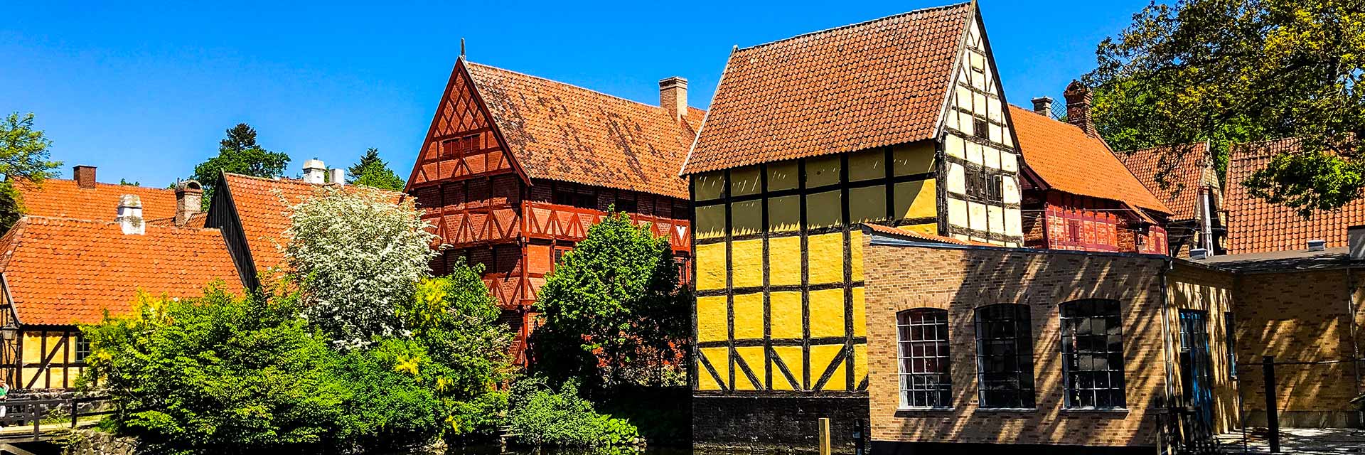 beautiful danish homes are located near a river in aarhus