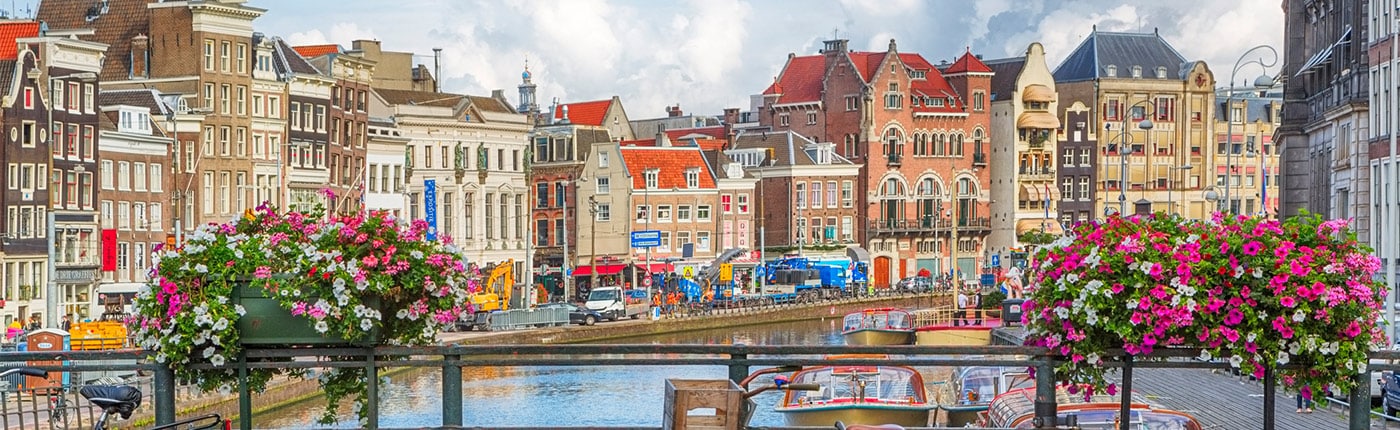 the beautiful colored buildings, bridges and canals of amsterdam