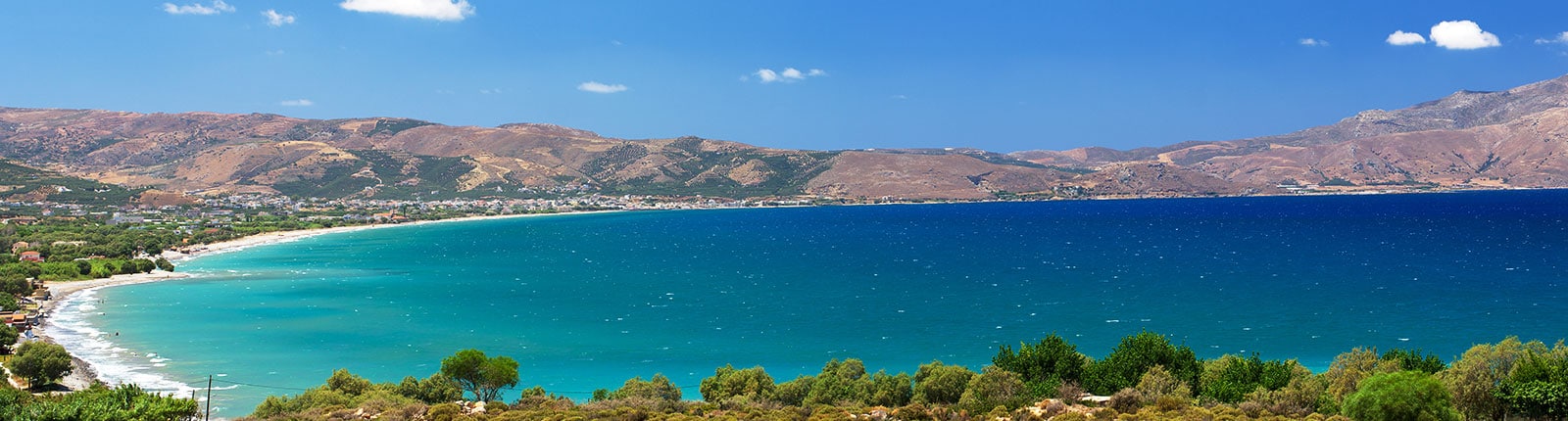 Stunning view of pristine beaches against mountains in Crete, Greece