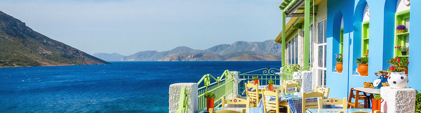 Colorful restaurant on the waters edge of Crete, Greece