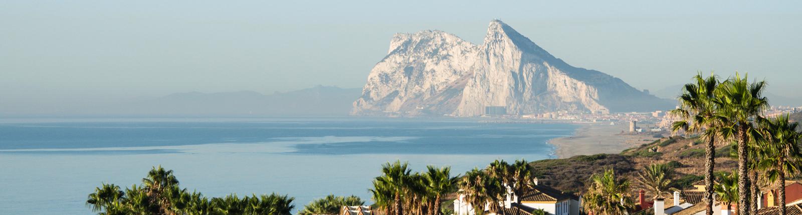 Rock of Gibraltar rising from the sea off in the distance