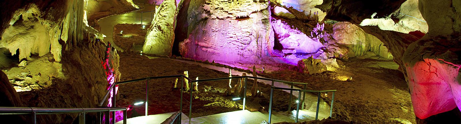 colorfully lit saint michael caves in gibraltar