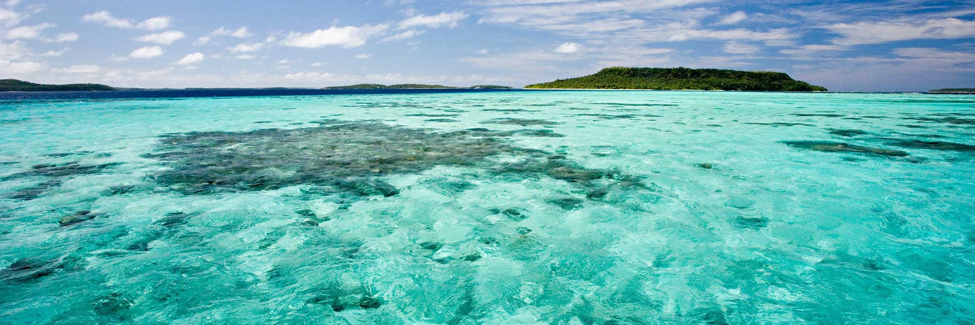 the ocean with different islands in the background