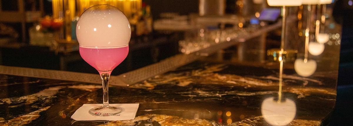 a bubble cocktail on top of the golden mermaid bar counter