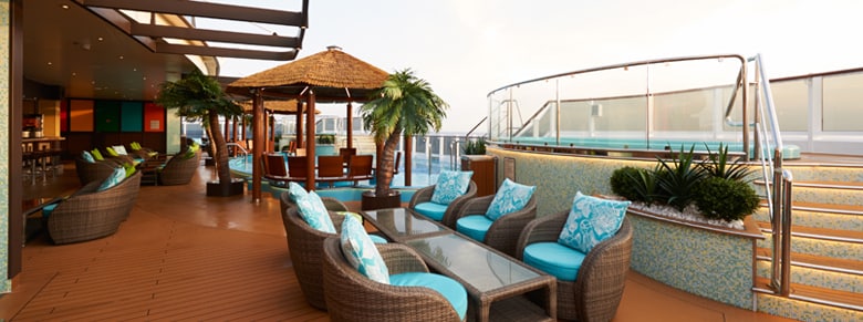 lounge chairs and coffee tables are located by the havana pool