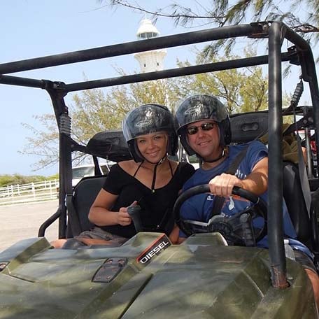 a couple enjoying the ATV excursion in grand turk