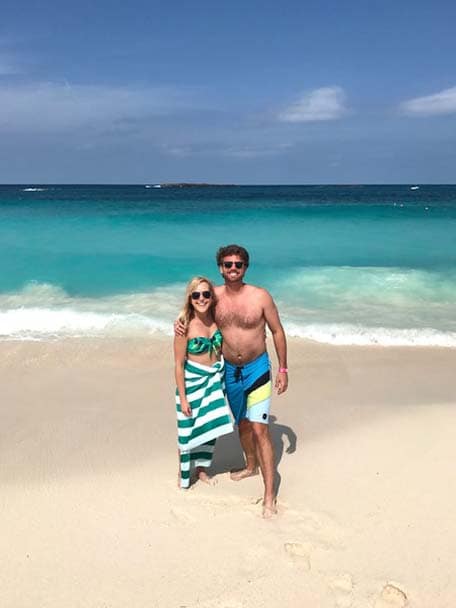 A medium shot of a couple on the beach at Nassau