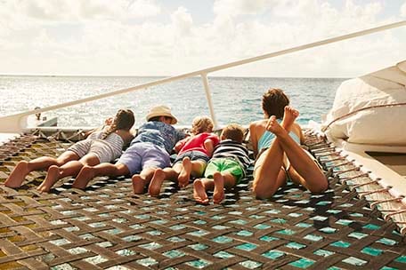 family sailing on a catamaran during a shore excursion