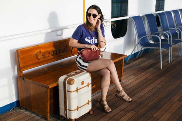 Caroline sitting on a bench on the Carnival Victory
