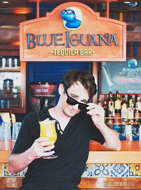 Randy sitting at the BlueIguana Tequila Bar holding a cocktail