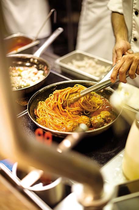 chef preparing spaghetti and meatballs