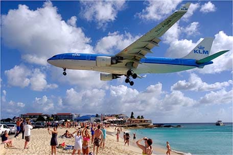 Plane flying overhead Maho Beach in St. Maarten