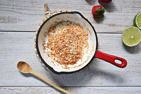 Toasted coconut in a skillet
