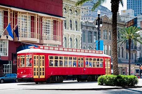 an iconic red streetcar in new orleans