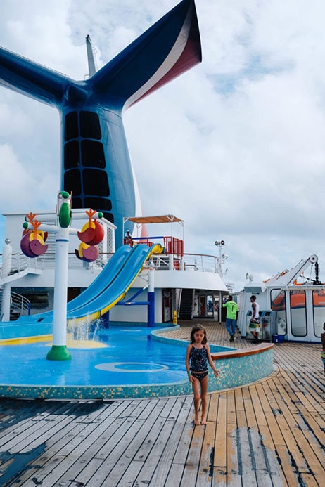 Drea’s daughter with waterslide and Carnival fin in background 