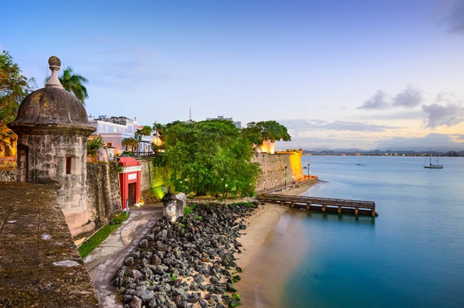 fortress walls on the shore of San Juan during the sunset