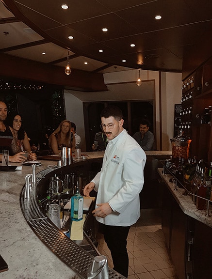 Nick Jonas bartending at Alchemy Bar
