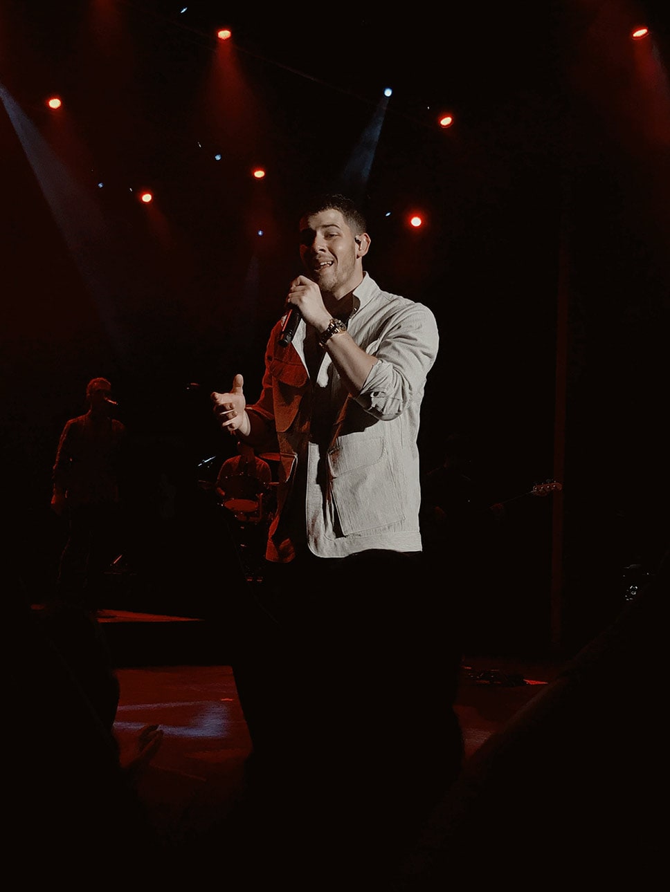 Nick Jonas singing on stage
