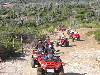 group of people exploring the east coast of Bonaire on ATVs