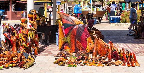 wood carvings in various sizes being sold in montego bay