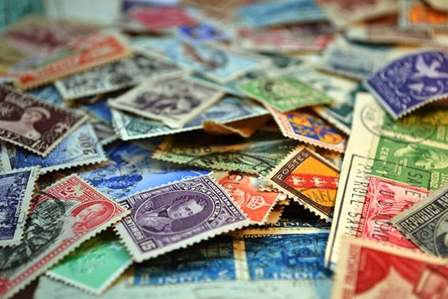 international stamps in a variety of colors
