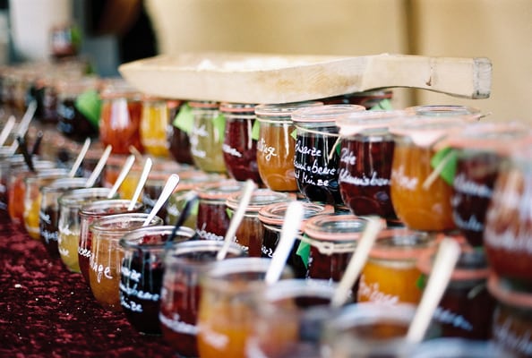variety of jams and jellies in glass containers