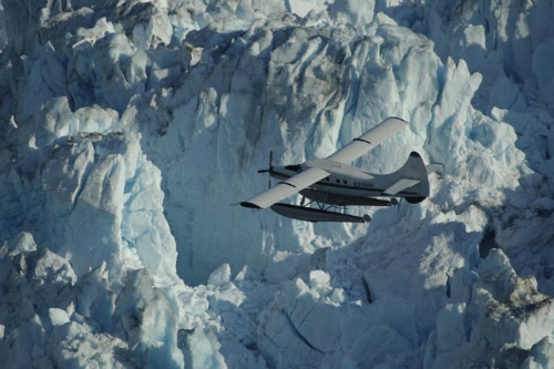 seaplane flying near breathtaking glacier in alaska