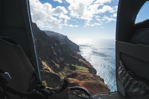 aerial view of the waimea canyon in kauai from the back seat of a helicopter