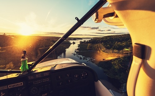 view of the alaskan landscape from a seaplane during the sun set 