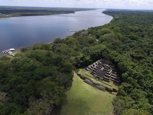 aerial of lamanai mayan ruins and the new river lagoon