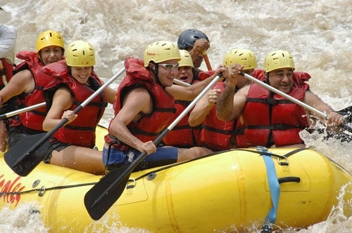 group of people whitewater rafting in limon