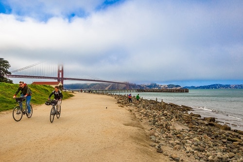 cyclists riding along the dirt roads of presidio in san francisco