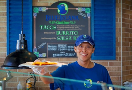 blueiguana cantina cook serving tacos onboard carnival legend 