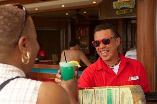 redfrog rum bar bartender handing out drinks on carnival magic 