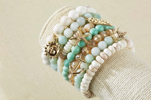 7 different mint and ivory bracelets with sea ornaments 