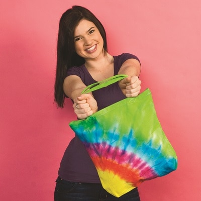 woman with tie dye tote