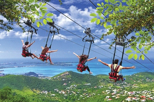 family of four going down the flying Dutchman in st maarten 