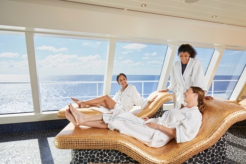friends laying in the thermal lounge at cloud 9 spa on board a carnival cruise