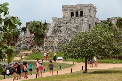 guest exploring ancient mayan temples in tulum during their cruise to ...