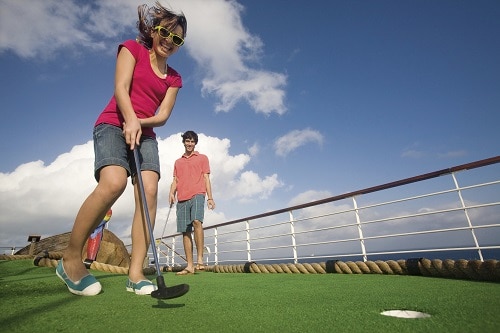 girl and boy playing mini golf on carnival valor