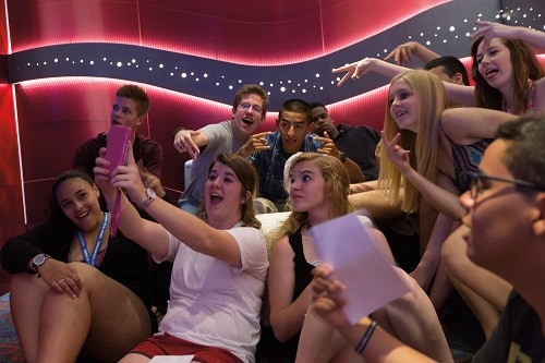group of teens taking a selfie at club o2