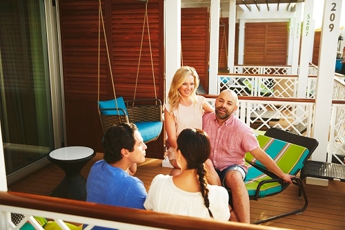 friends talking out on a stateroom balcony