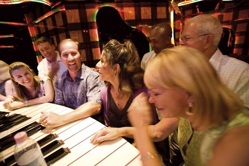 friends having a great time at the piano bar