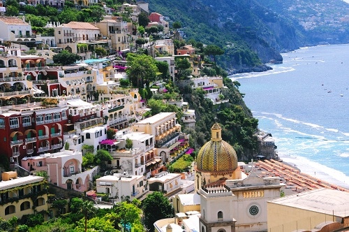 an aerial view of positano and the surrounding beach
