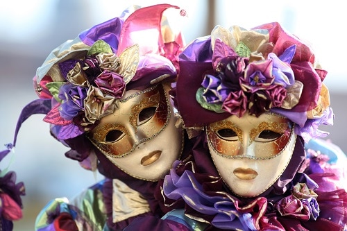 a couple wearing masquerade masks