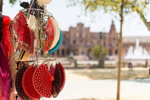 a display of spanish flamenco fans at a marketplace in spain
