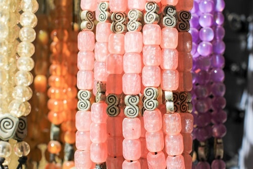 pink worry beads for sale at a greek market