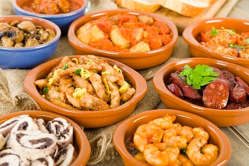 tapas bowls holding different foods from malaga