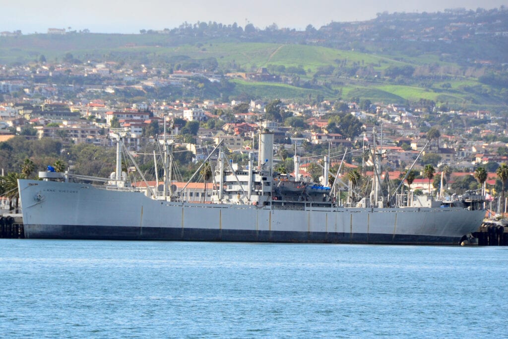 ALT TEXT: The SS Lane Victory, now a museum ship, docked in Los Angeles.